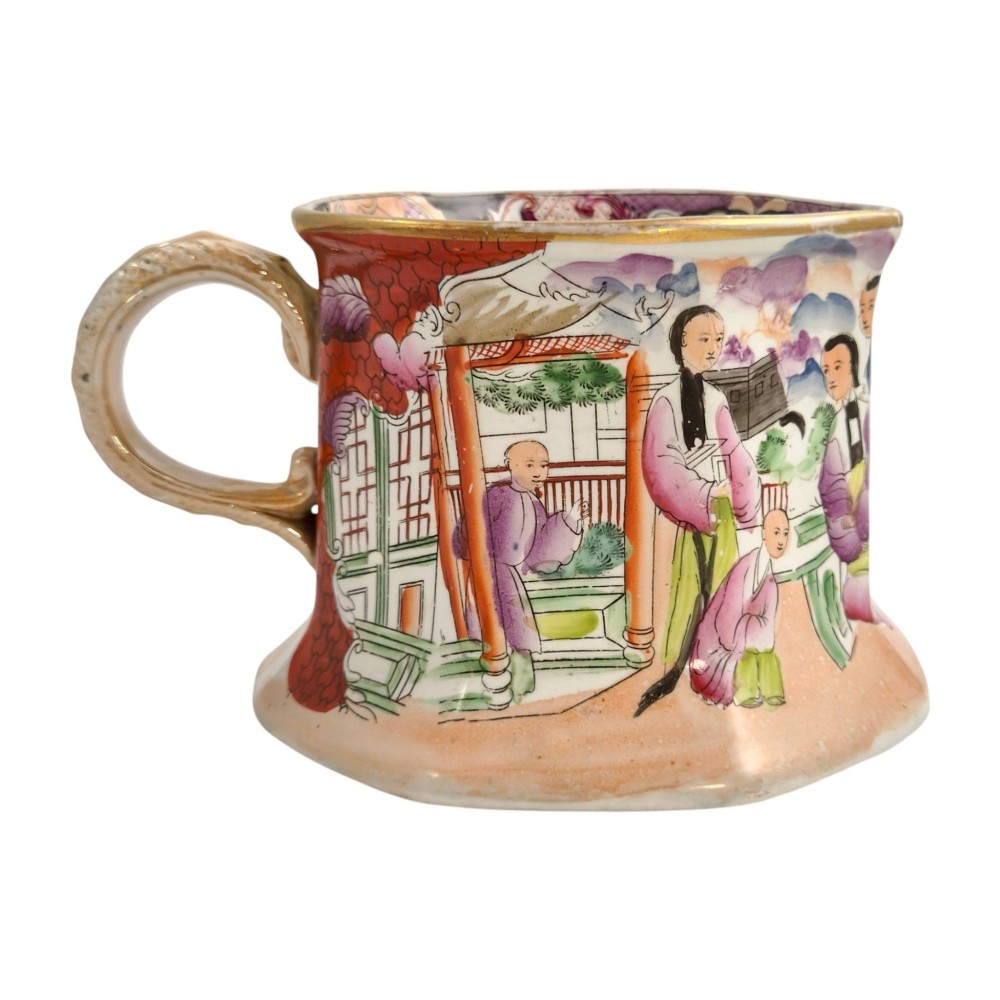 An antique Masons ironstone cider mug featuring a red scale background, hand-painted Chinoiserie panels, a flared base, and a sculpted hydra handle. View V