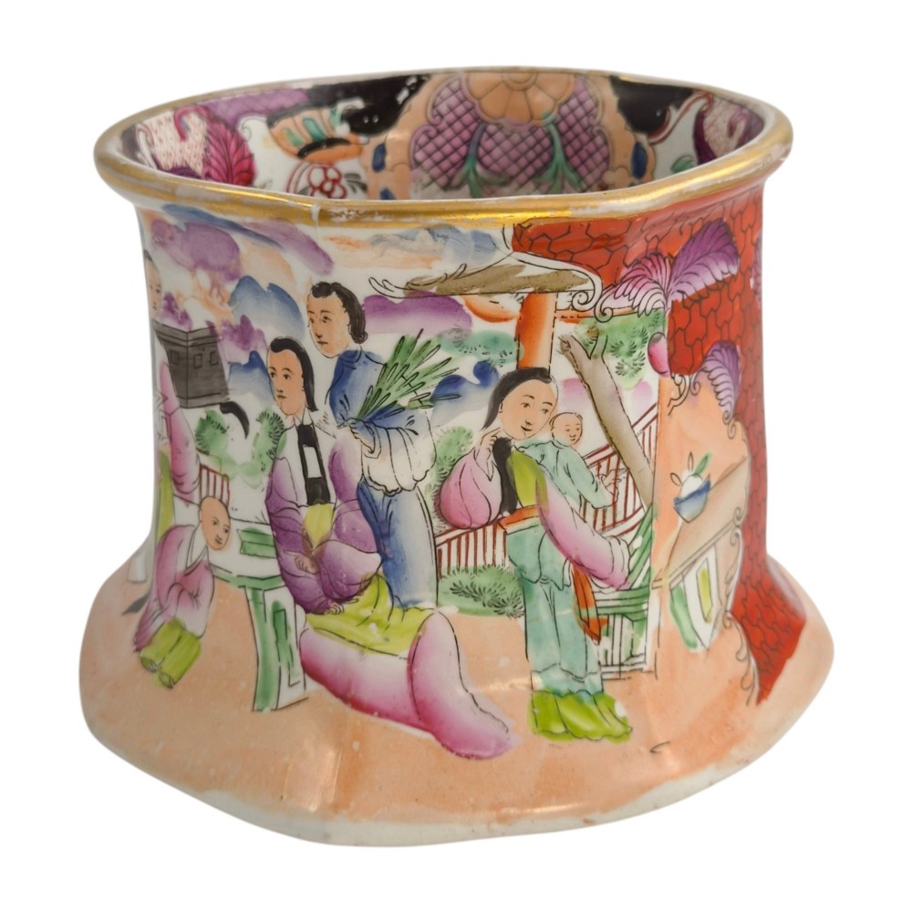 An antique Masons ironstone cider mug featuring a red scale background, hand-painted Chinoiserie panels, a flared base, and a sculpted hydra handle. View VII