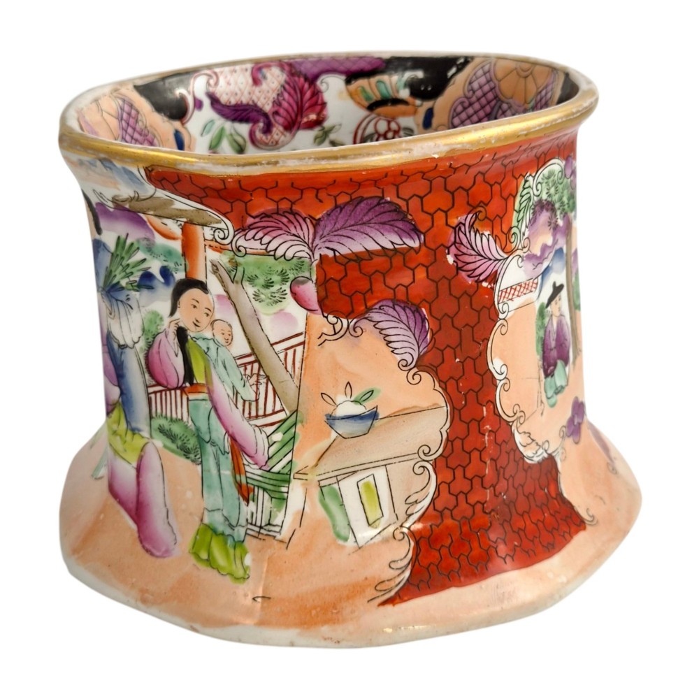 An antique Masons ironstone cider mug featuring a red scale background, hand-painted Chinoiserie panels, a flared base, and a sculpted hydra handle. View VIII