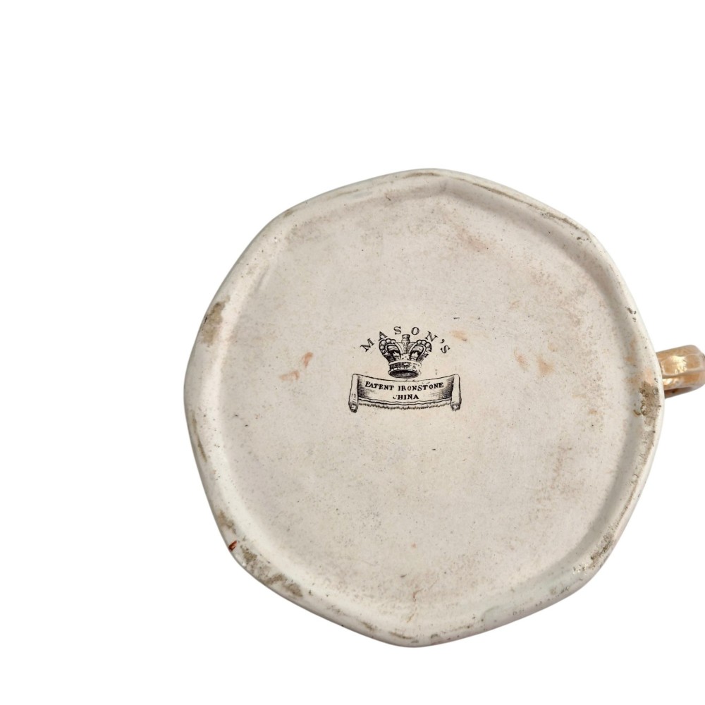 An antique Masons ironstone cider mug featuring a red scale background, hand-painted Chinoiserie panels, a flared base, and a sculpted hydra handle. View XI
