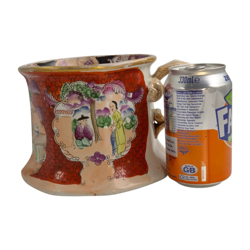 An antique Masons ironstone cider mug featuring a red scale background, hand-painted Chinoiserie panels, a flared base, and a sculpted hydra handle. View XV