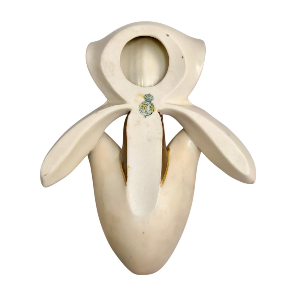 A pair of 1886 Royal Worcester ivory porcelain wall pockets shaped like ladys slipper orchids with gold gilded highlights. View V