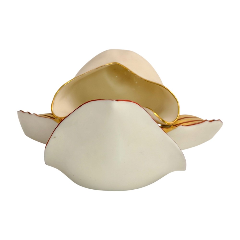 A pair of 1886 Royal Worcester ivory porcelain wall pockets shaped like ladys slipper orchids with gold gilded highlights. View IX