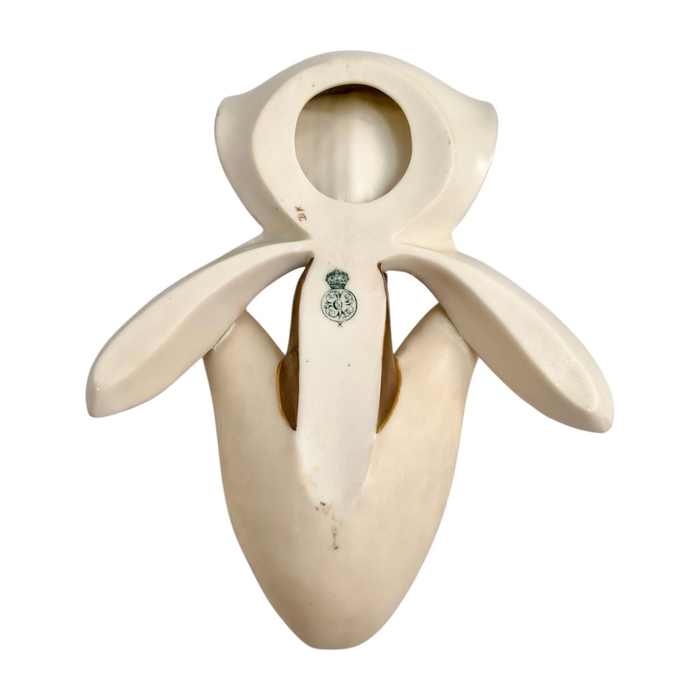 A pair of 1886 Royal Worcester ivory porcelain wall pockets shaped like ladys slipper orchids with gold gilded highlights. View X
