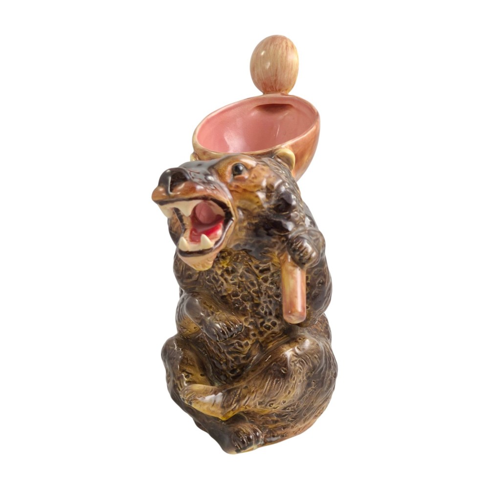 A set of three graduating Victorian majolica syrup jugs sculpted in the form of seated bears with pink glazed interiors. View II