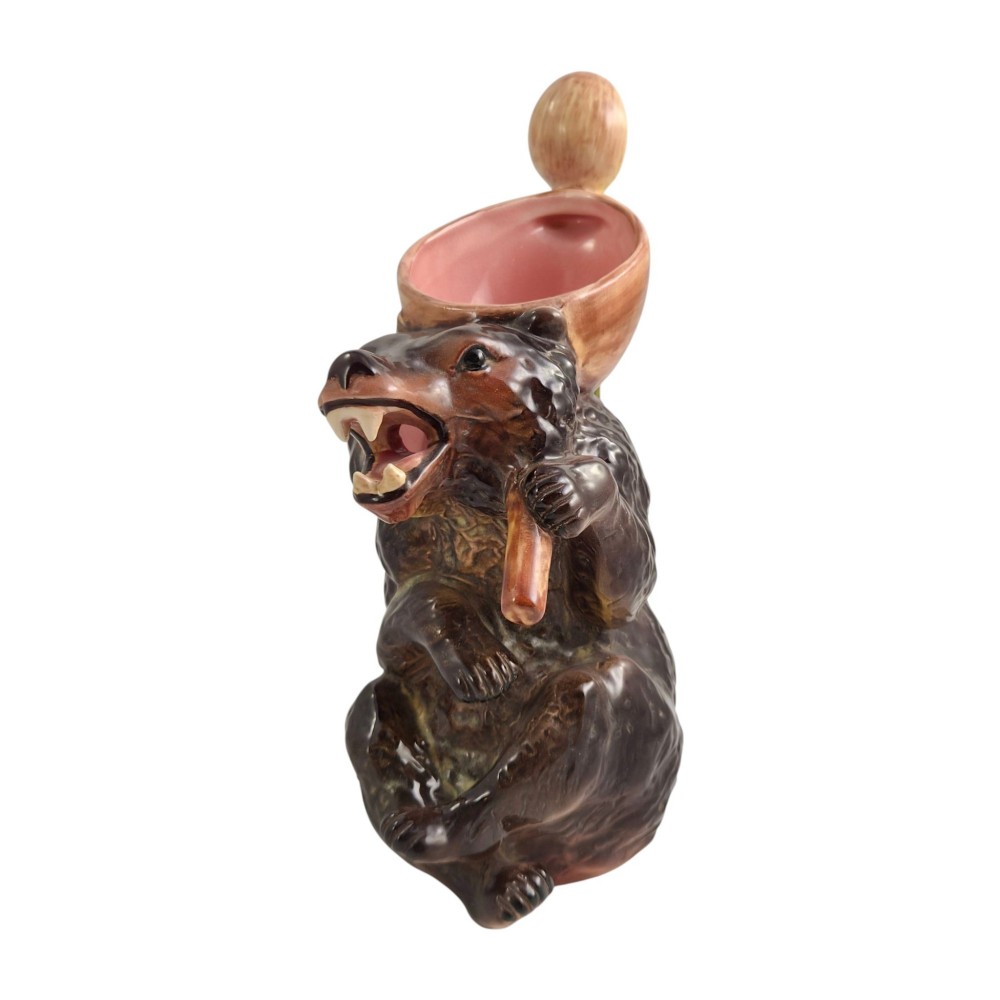 A set of three graduating Victorian majolica syrup jugs sculpted in the form of seated bears with pink glazed interiors. View IX