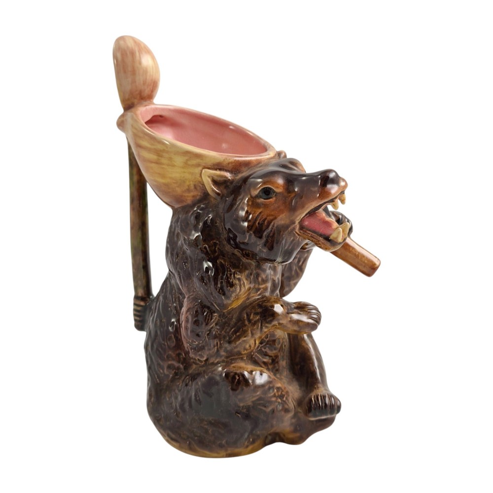 A set of three graduating Victorian majolica syrup jugs sculpted in the form of seated bears with pink glazed interiors. View XII