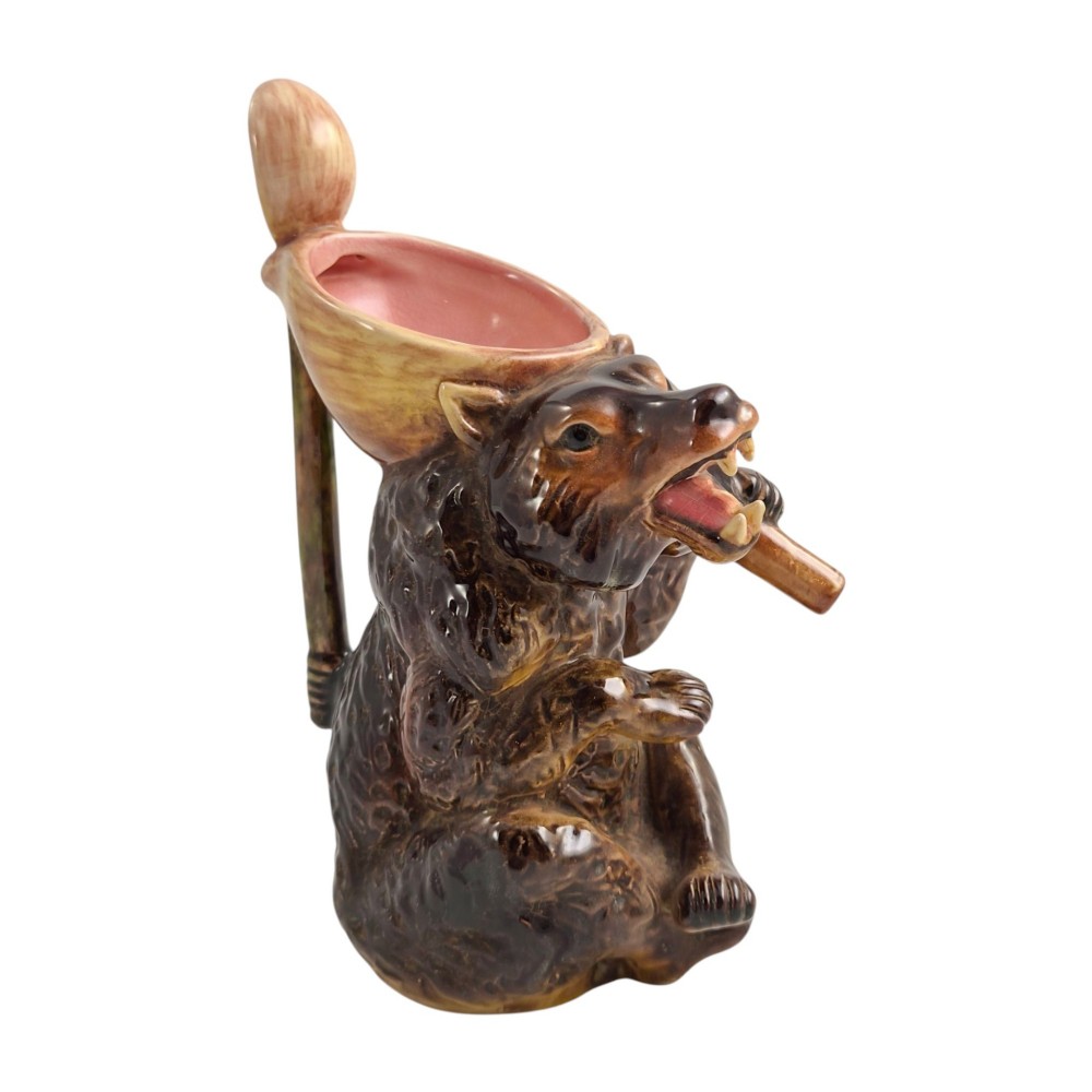 A set of three graduating Victorian majolica syrup jugs sculpted in the form of seated bears with pink glazed interiors. View XIV