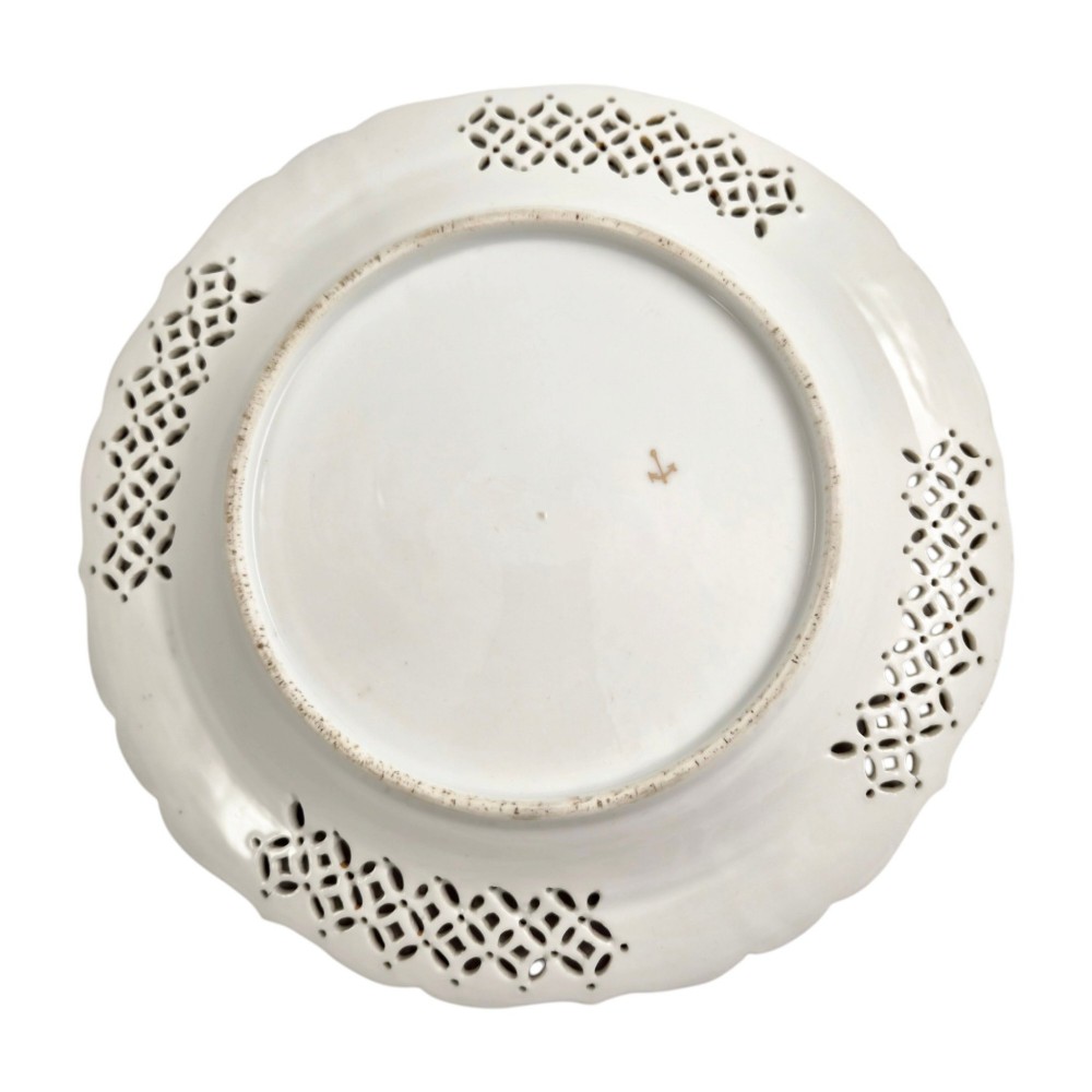 Set of three white porcelain cabinet plates featuring pierced lattice rims decorated with gold gilding, pink scrolls, green accents, and hand-painted exotic birds in the centre. View VIII