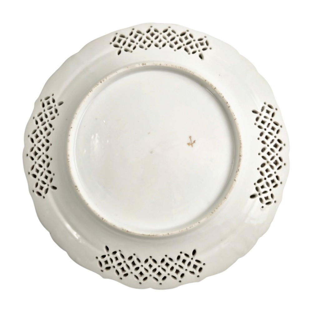 Set of three white porcelain cabinet plates featuring pierced lattice rims decorated with gold gilding, pink scrolls, green accents, and hand-painted exotic birds in the centre. View XI