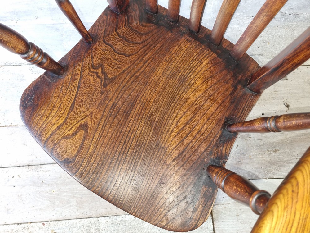 A Victorian lath back Windsor armchair crafted from warm brown polished wood with a shaped elm seat and turned beech legs. View XI