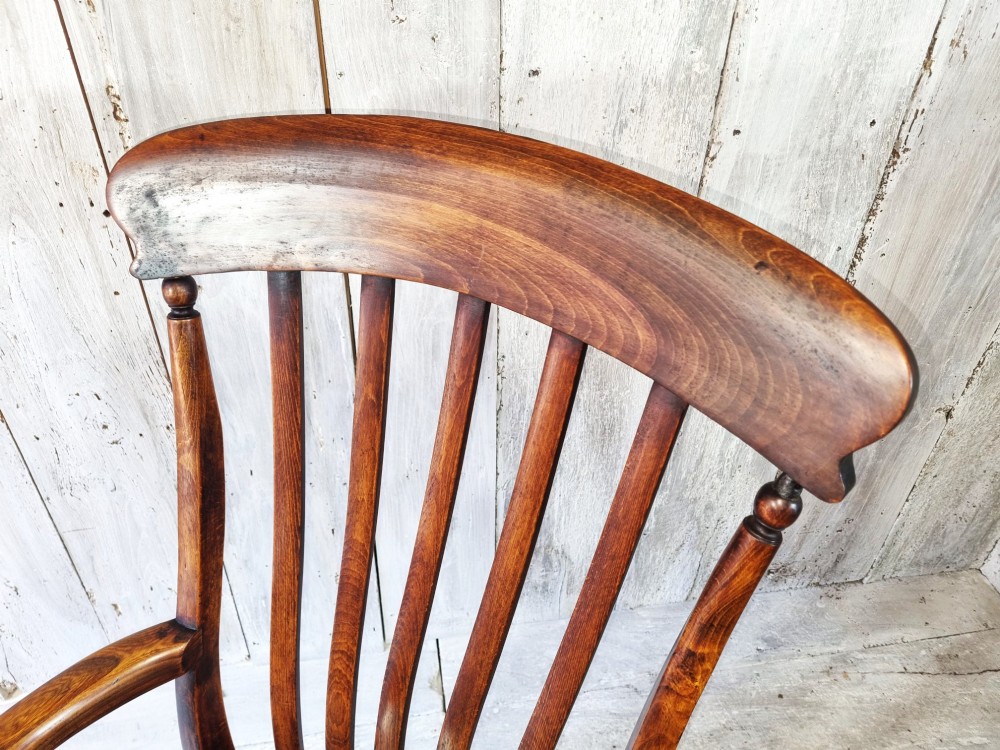 A Victorian lath back Windsor armchair crafted from warm brown polished wood with a shaped elm seat and turned beech legs. View XII