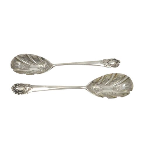 fig 1. A pair of Victorian sterling silver preserve spoons with fluted shell-form bowls housed inside a blue velvet-lined presentation case.