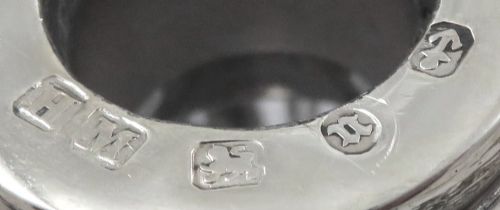 fig 1. A late Victorian cut-glass scent bottle featuring an intricate pierced sterling silver outer scrollwork overlay and a silver embossed cap.
