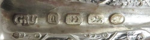fig 1. A pair of Victorian sterling silver open salt cellars shaped like scallop shells with ornate cast feet.