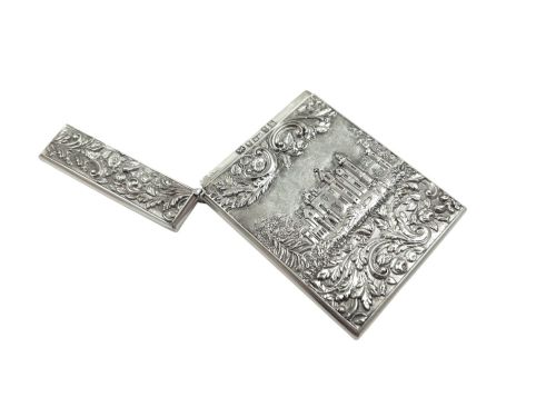 fig 1. An antique sterling silver card case featuring an architectural relief depiction of Newstead Abbey framed by ornate scrollwork.