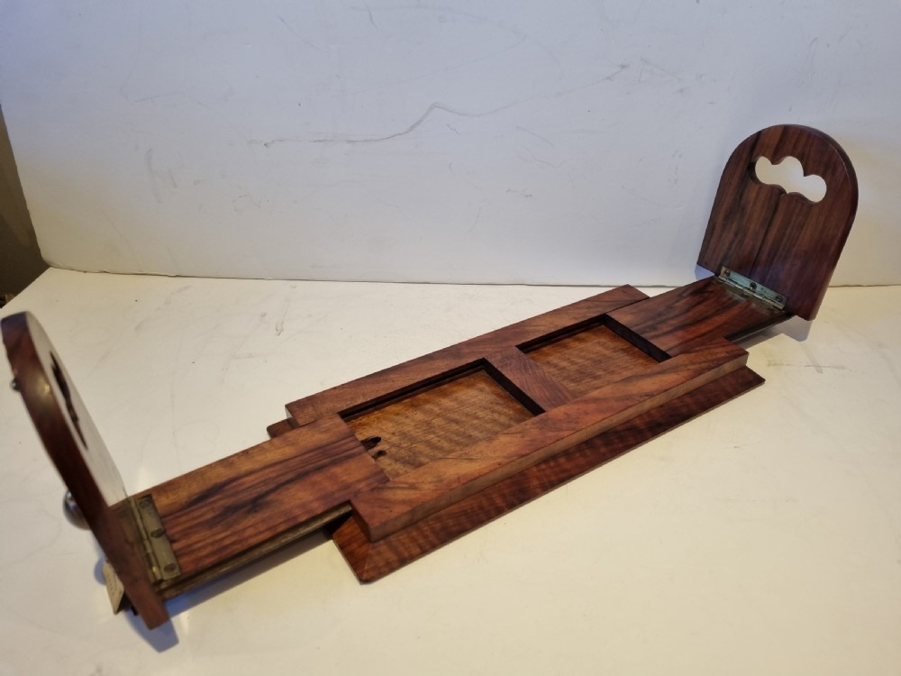 A Victorian walnut expanding book slide featuring hinged arched ends ornamented with pierced brass gothic strapwork and inset agate cabochons. View IV
