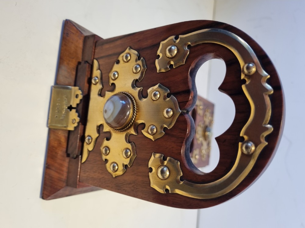 A Victorian walnut expanding book slide featuring hinged arched ends ornamented with pierced brass gothic strapwork and inset agate cabochons. View IX