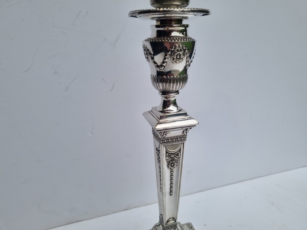 A Victorian silver-plated table lamp base featuring a square stepped foot, a tapered column shaft, and Neoclassical festoon engravings. View II