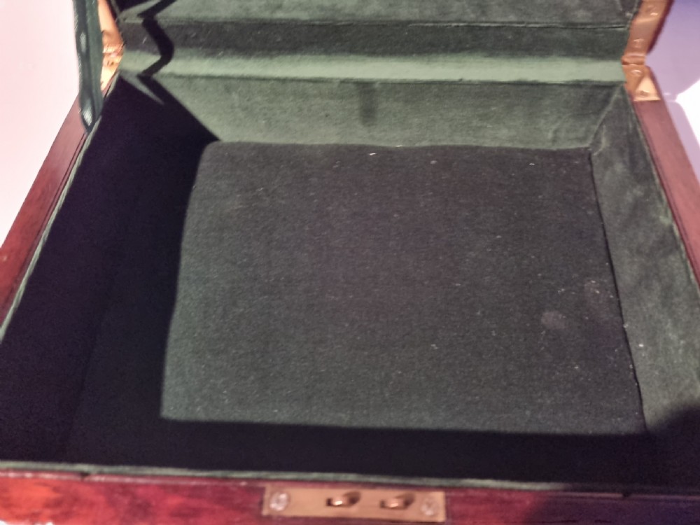A rectangular dark rosewood document box featuring brass edge binding, an oval brass keyhole escutcheon, and an oval brass top inlay. View IX