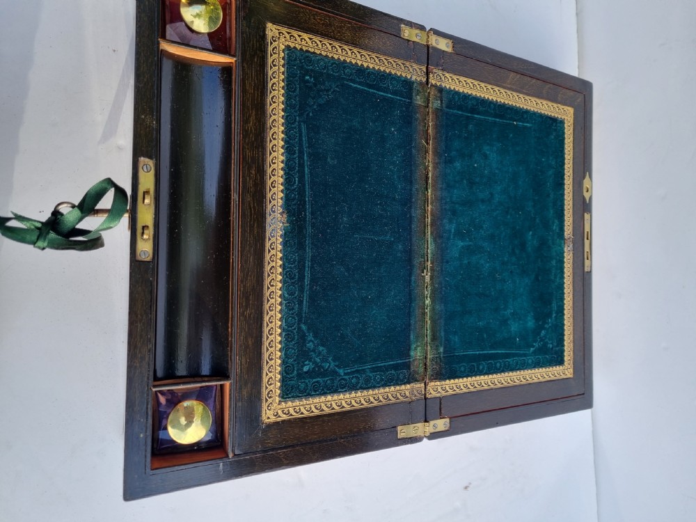A rectangular Victorian walnut writing box with intricate geometric parquetry inlay borders and a central brass keyhole. View VIII