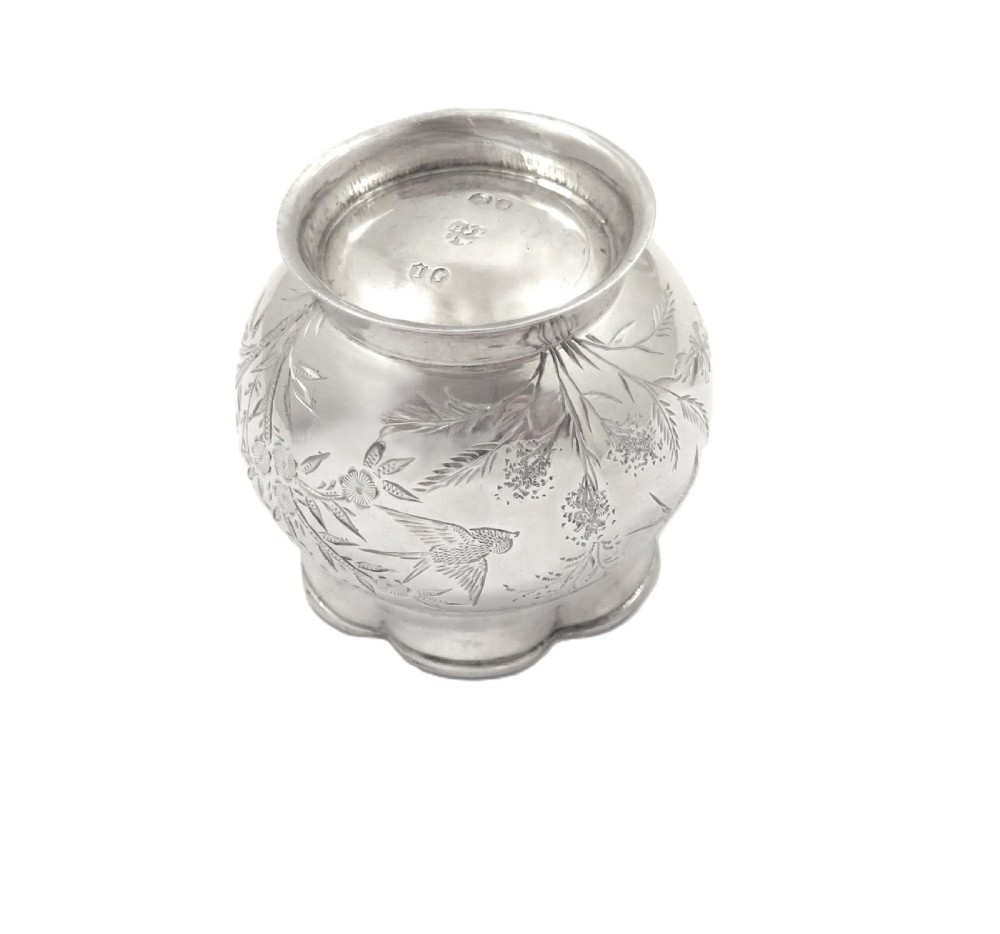 A pair of Victorian engraved sterling silver salt cellars with matching spoons displayed inside an open fitted purple silk-lined presentation case. View XI