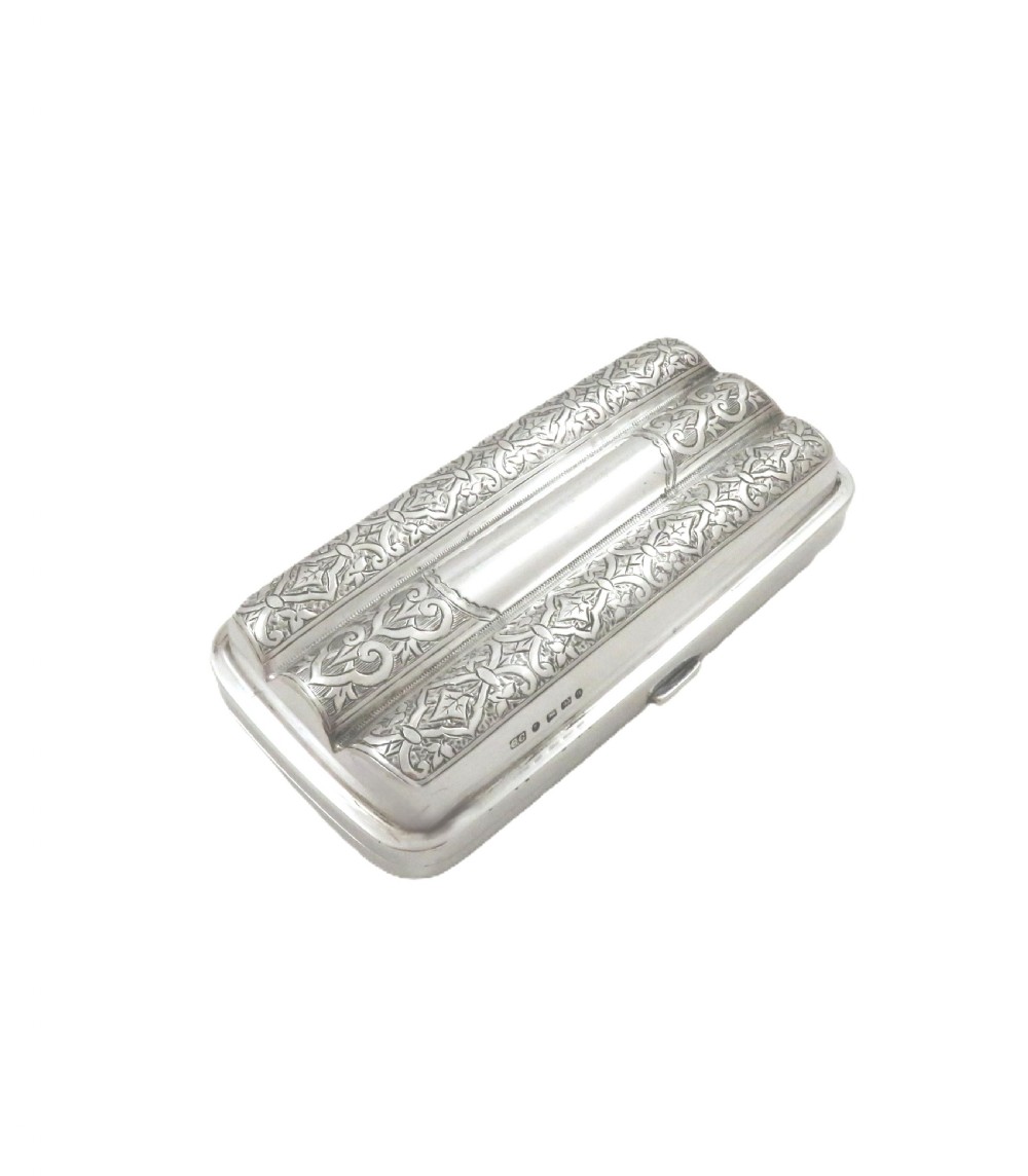 An engraved Victorian sterling silver cigar case featuring three contoured sections and intricate foliate patterns with stamped hallmarks.