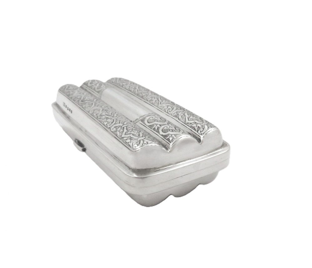 An engraved Victorian sterling silver cigar case featuring three contoured sections and intricate foliate patterns with stamped hallmarks. View VIII