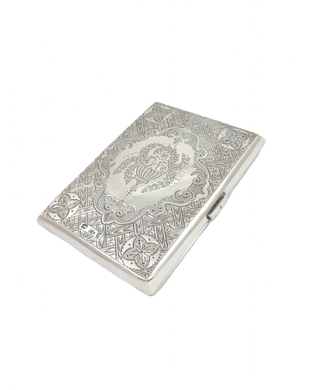 An antique Victorian sterling silver card case featuring geometric engine turning, floral engraving, and British silver hallmarks.
