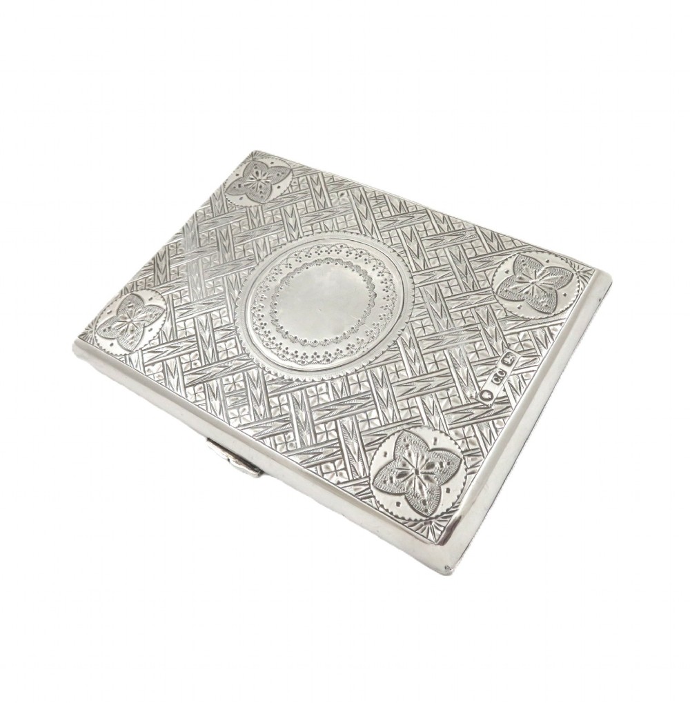 An antique Victorian sterling silver card case featuring geometric engine turning, floral engraving, and British silver hallmarks. View III