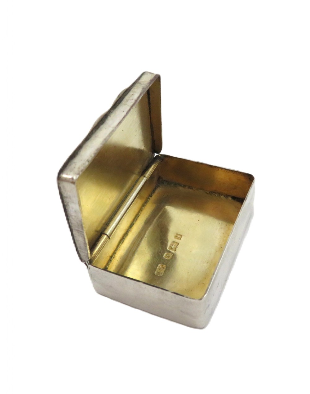A small rectangular Victorian sterling silver box featuring relief foliage motifs and an unengraved central cartouche. View VII