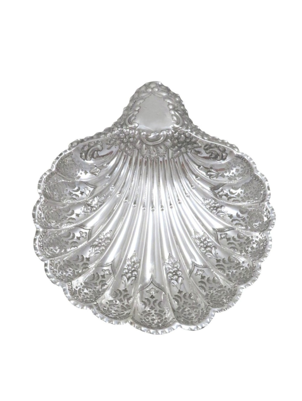 A Victorian sterling silver dish shaped like a scallop shell with intricate repousse foliage and pierced fluted details. View VII