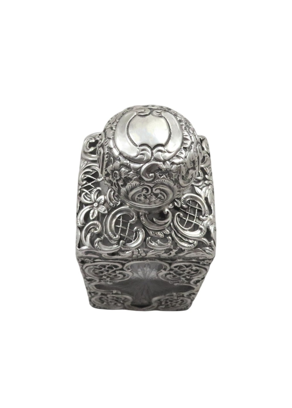 A late Victorian cut-glass scent bottle featuring an intricate pierced sterling silver outer scrollwork overlay and a silver embossed cap. View VIII