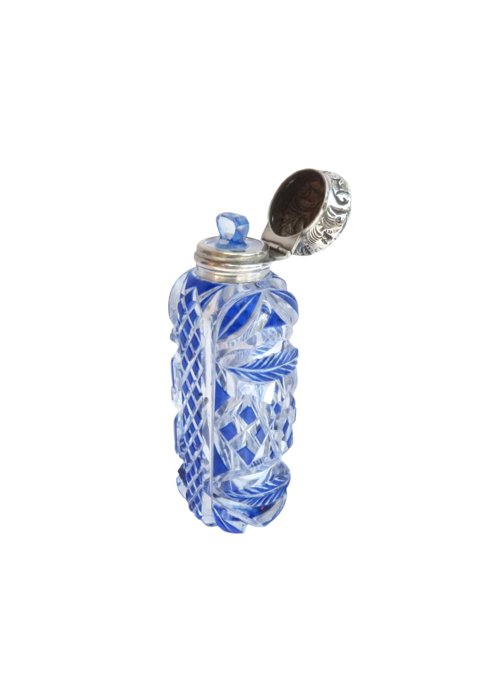 A Victorian blue overlay cut glass scent bottle with an embossed sterling silver top. View VIII