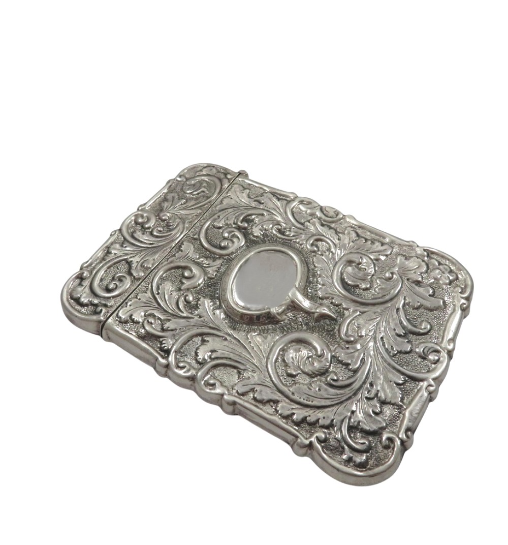 A Victorian sterling silver card case featuring a raised relief depiction of Windsor Castle framed by intricate scrollwork. View V