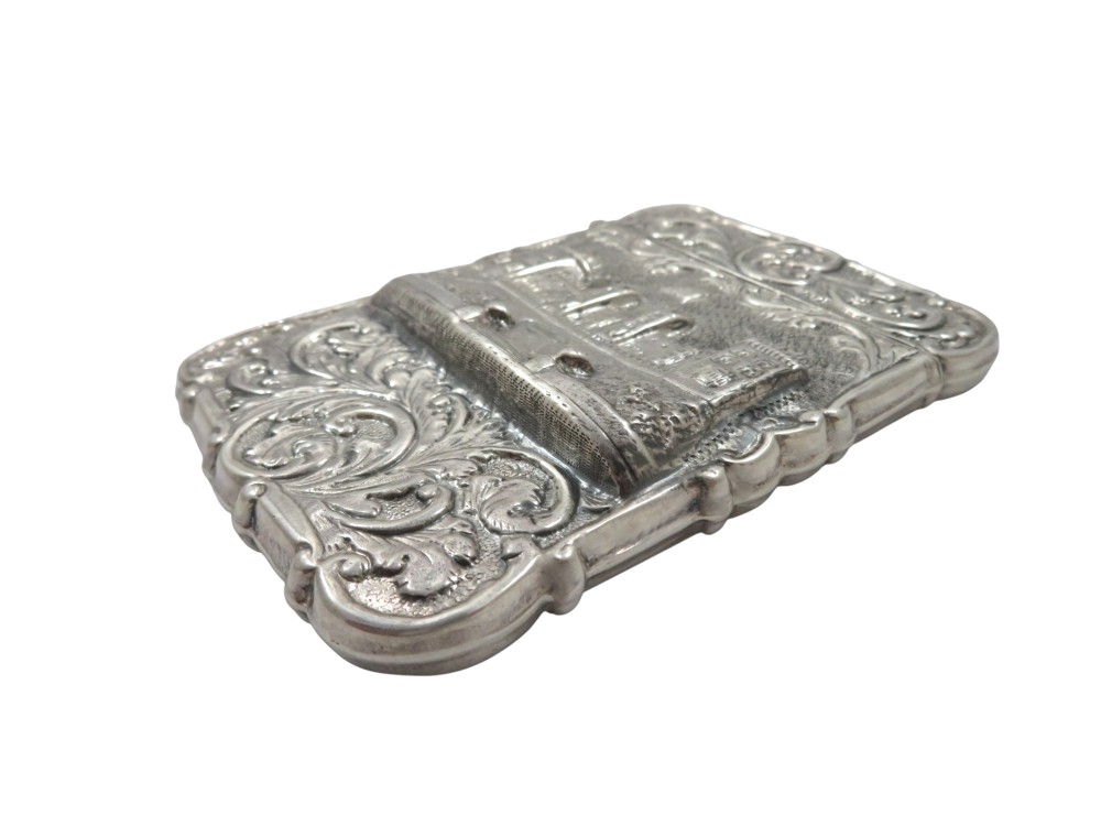 A Victorian sterling silver card case featuring a raised relief depiction of Windsor Castle framed by intricate scrollwork. View VII