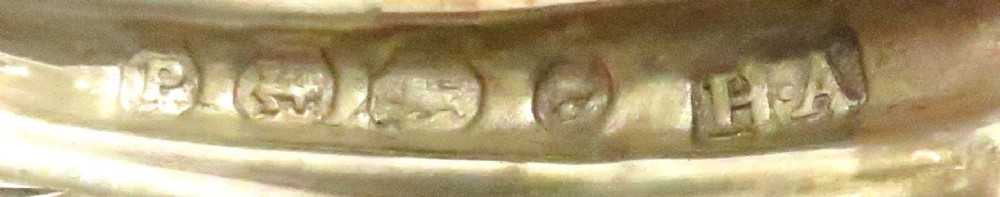 A pair of Victorian sterling silver open salt cellars shaped like scallop shells supported by cast dolphin feet. View II