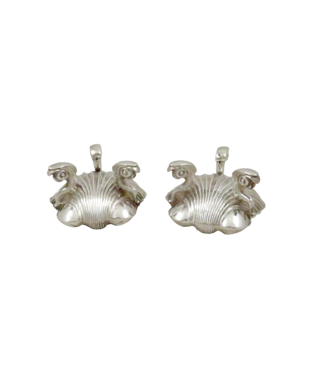 A pair of Victorian sterling silver open salt cellars shaped like scallop shells supported by cast dolphin feet. View VII