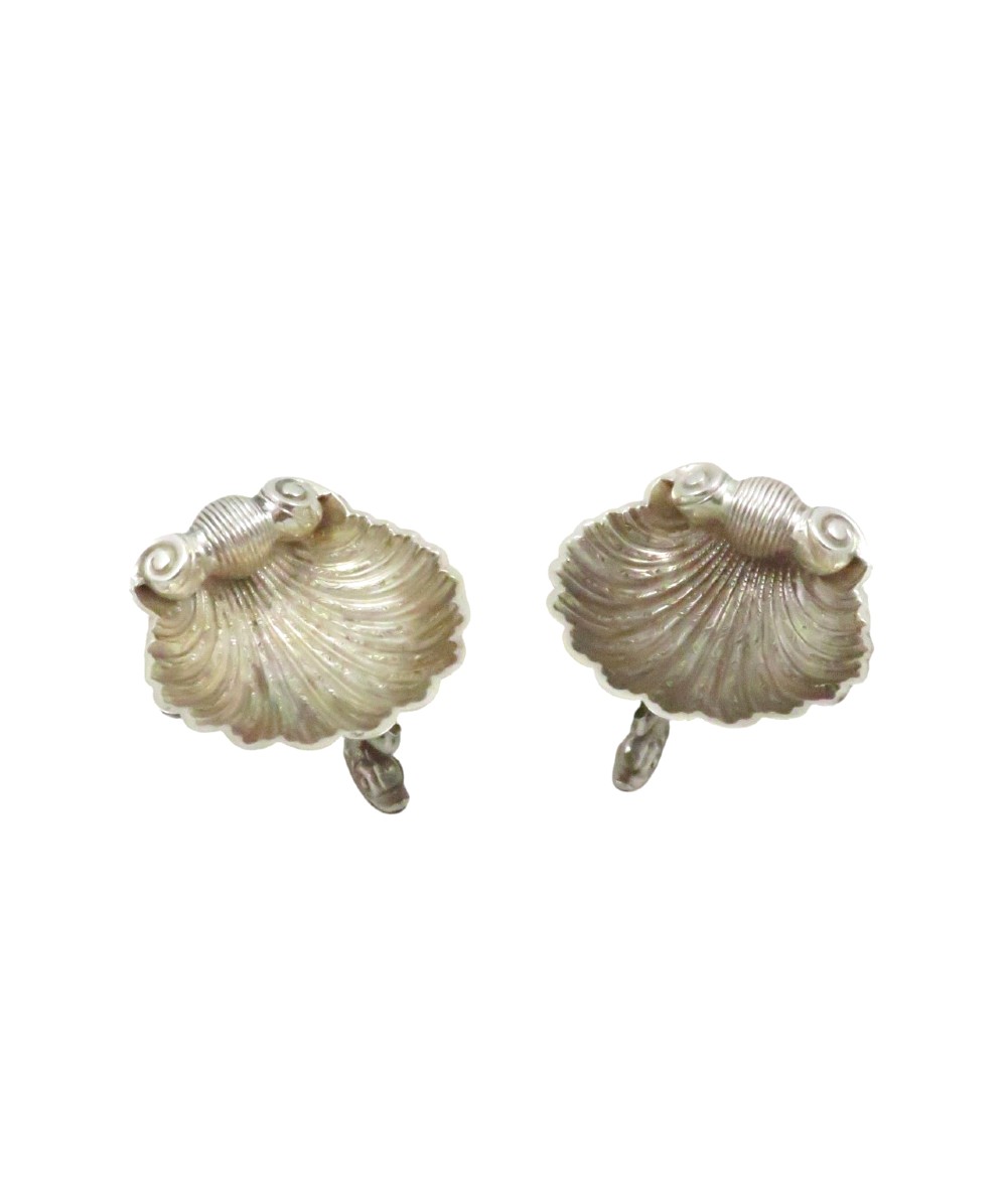 A pair of Victorian sterling silver open salt cellars shaped like scallop shells supported by cast dolphin feet. View VIII