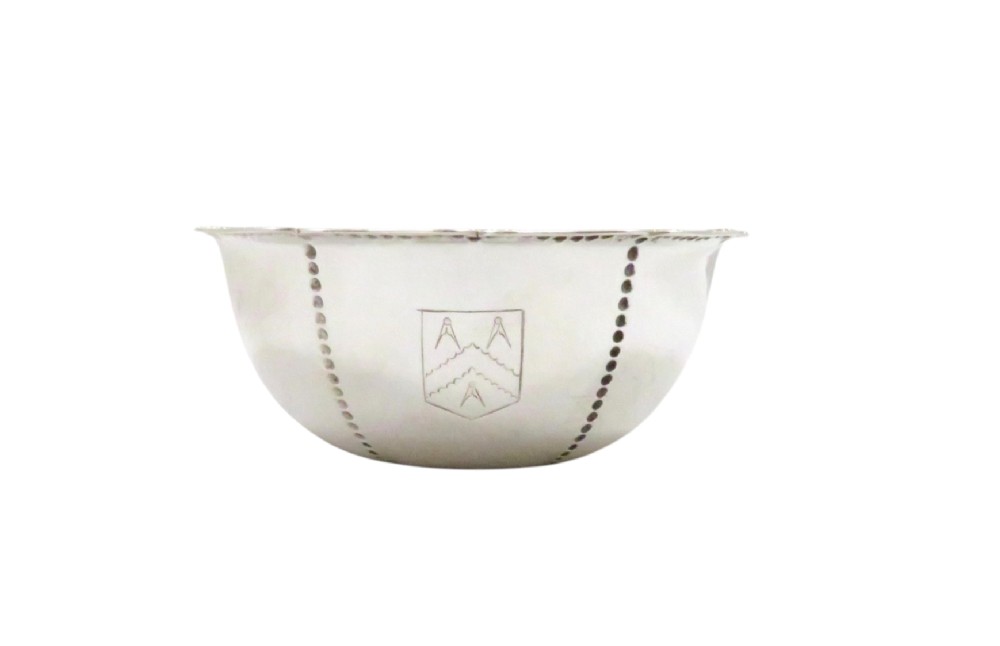 An Edwardian sterling silver fluted bowl featuring beaded rim detailing, resting inside a dark satin-lined presentation case. View III
