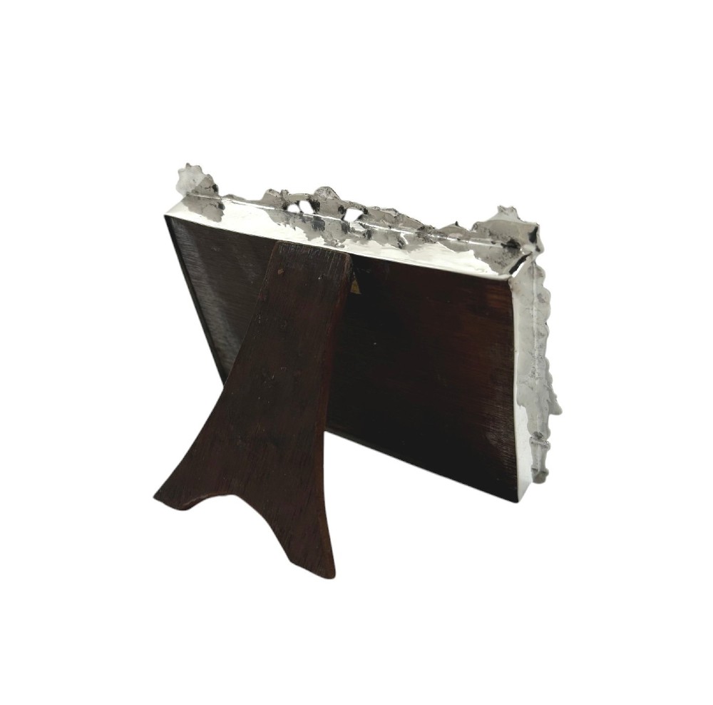 An ornate rectangular sterling silver landscape photo frame featuring detailed repousse scrollwork around the border. View V