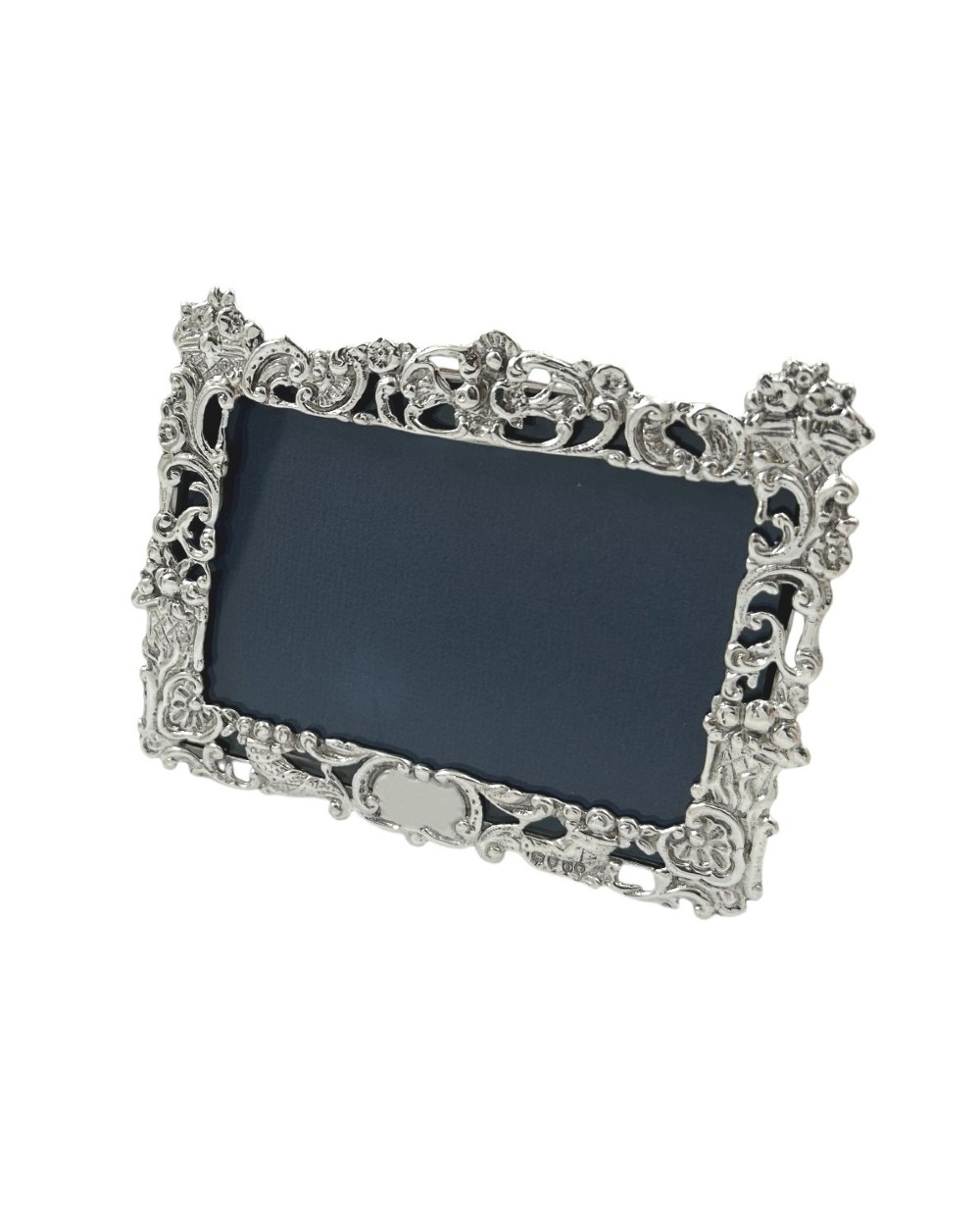 An ornate rectangular sterling silver landscape photo frame featuring detailed repousse scrollwork around the border. View IX