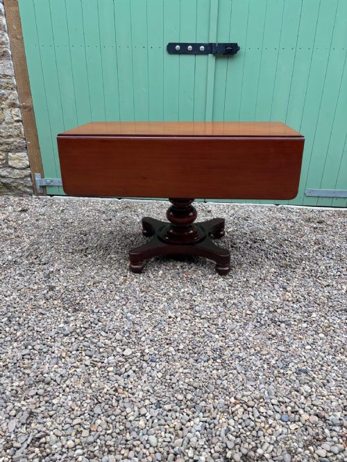 An Early Victorian Mahogany Drop Leaf Table