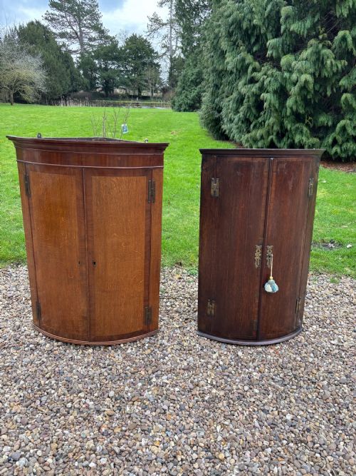 Two Georgian Oak and Mahogany Hanging Corner Cupboards