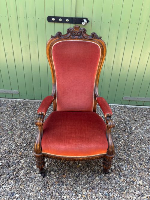 A VICTORIAN OAK OPEN ARM ARMCHAIR