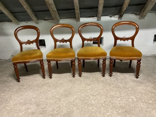 A Set of Four Victorian Mahogany Balloon Back Dining Chairs
