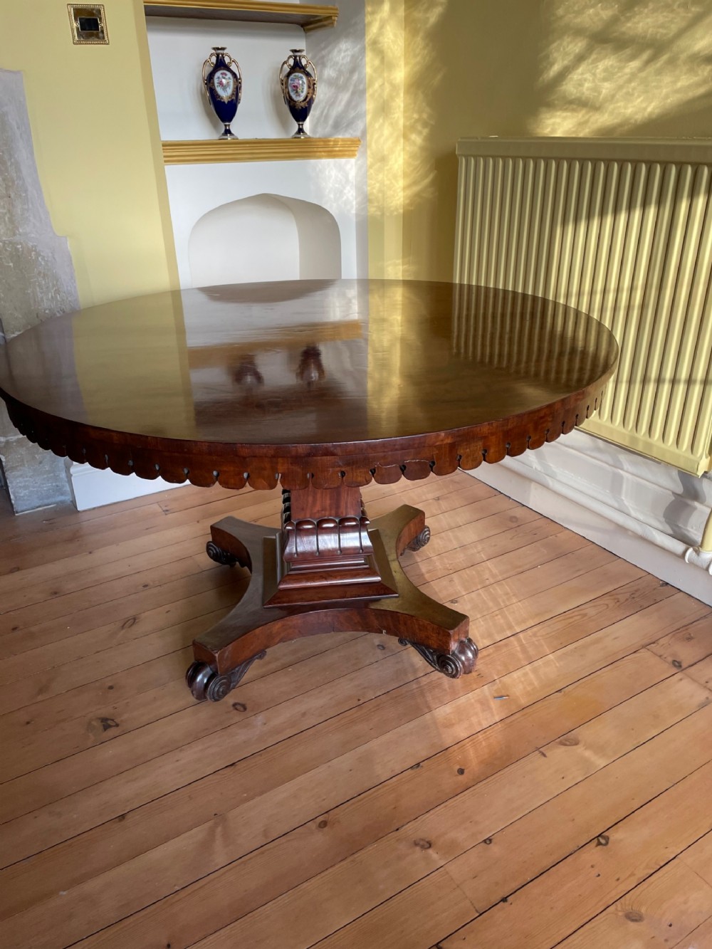 William 1V circular flame mahogany dining table