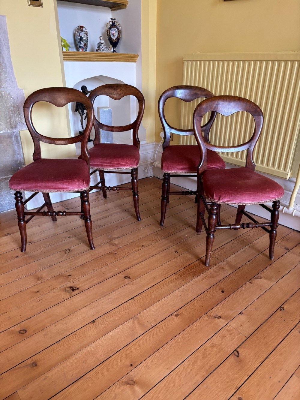 A set of four Victorian Balloon back beech bedroom chairs