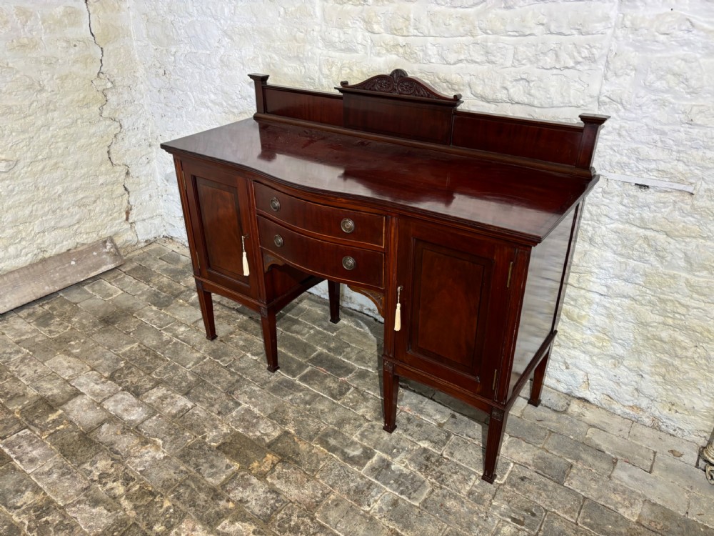 An Edwardian mahogany Sideboard View II