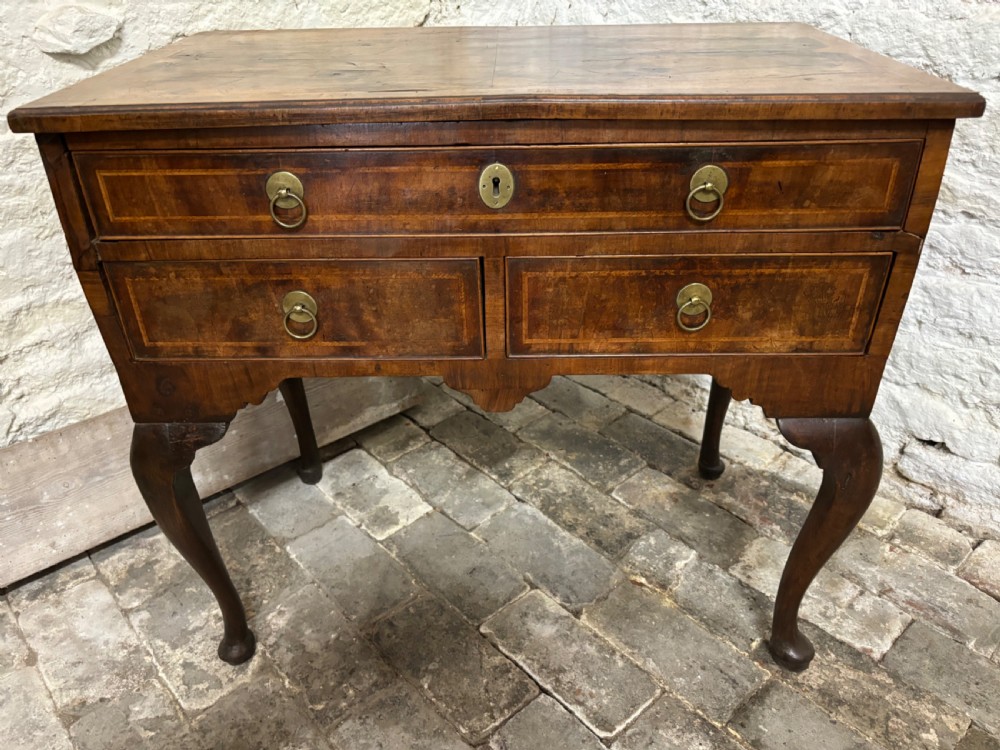 Georgian walnut and cross banded Lowboy View II